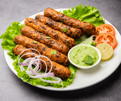 seekh-kabab-served-in-plate-with-green-chutney-V9U87HS.png